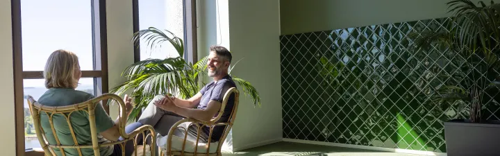 woman and man in green office